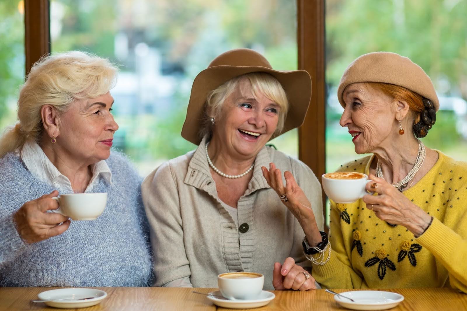 senior women enjoying coffee together