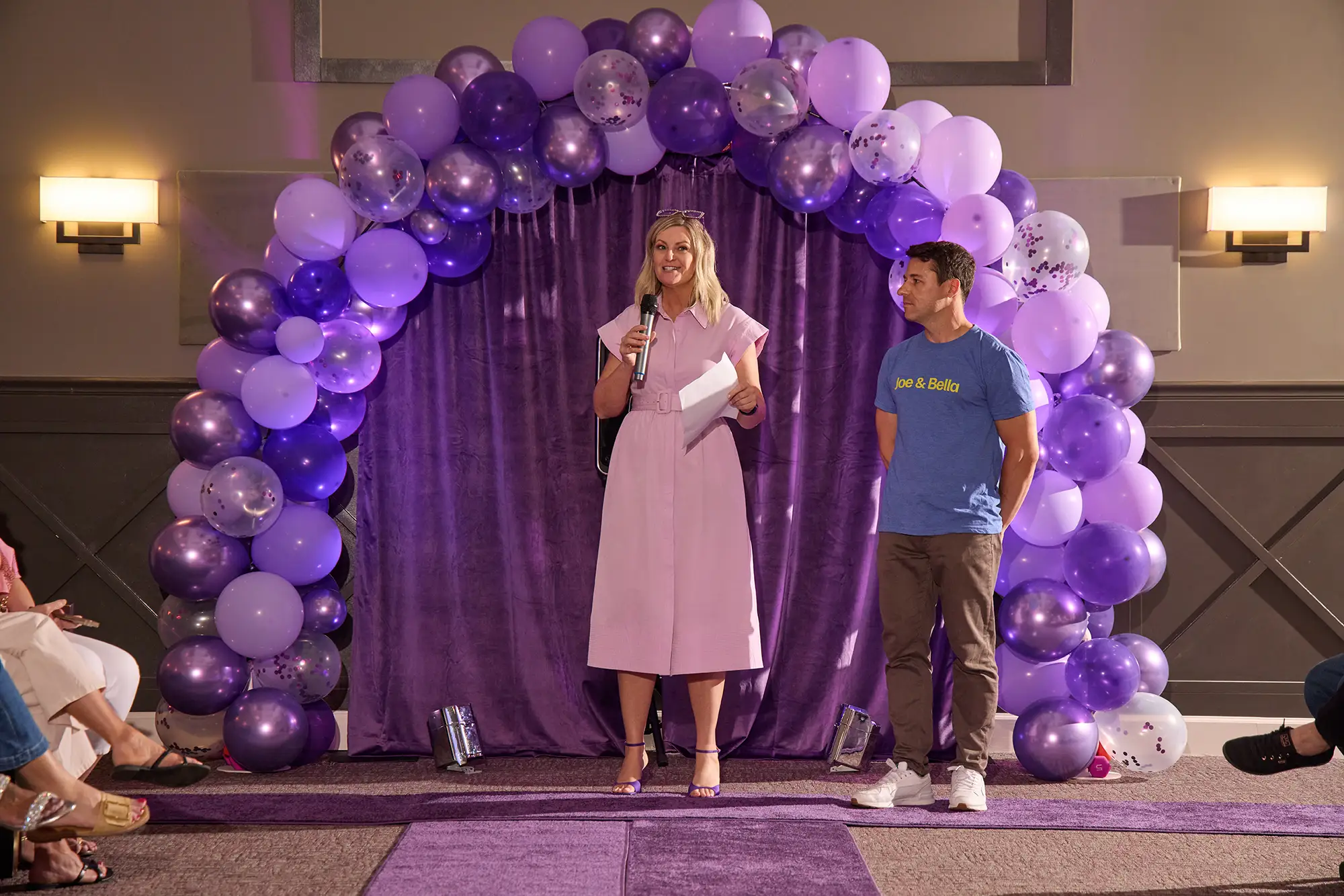 A speaker on stage at a fundraiser for The Longest Day®